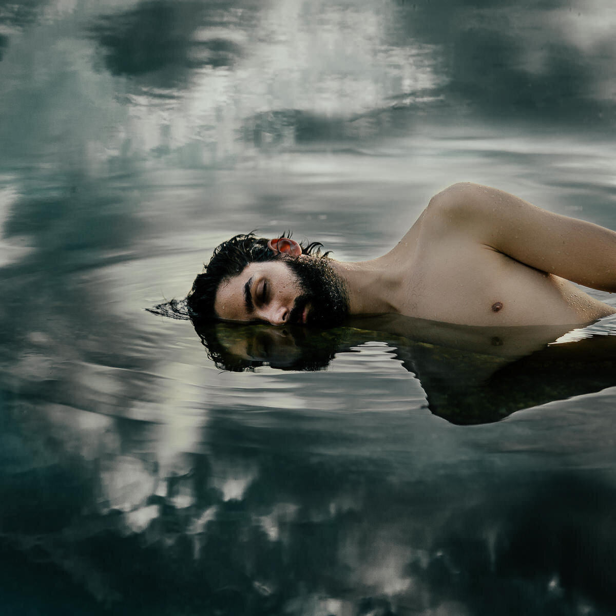 Fine Art Portrait of a man lying in the water