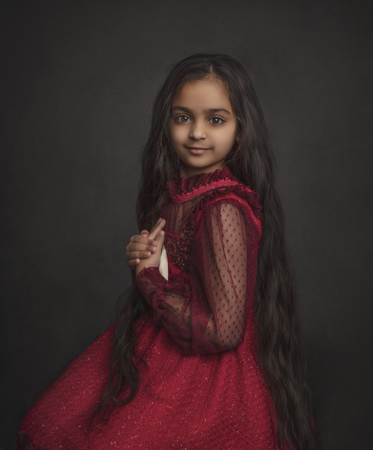 Young girl in red couture gown posing for a photo in a portrait studio/ Sonia Gourlie Fine Art Photography / Ottawa Ontario