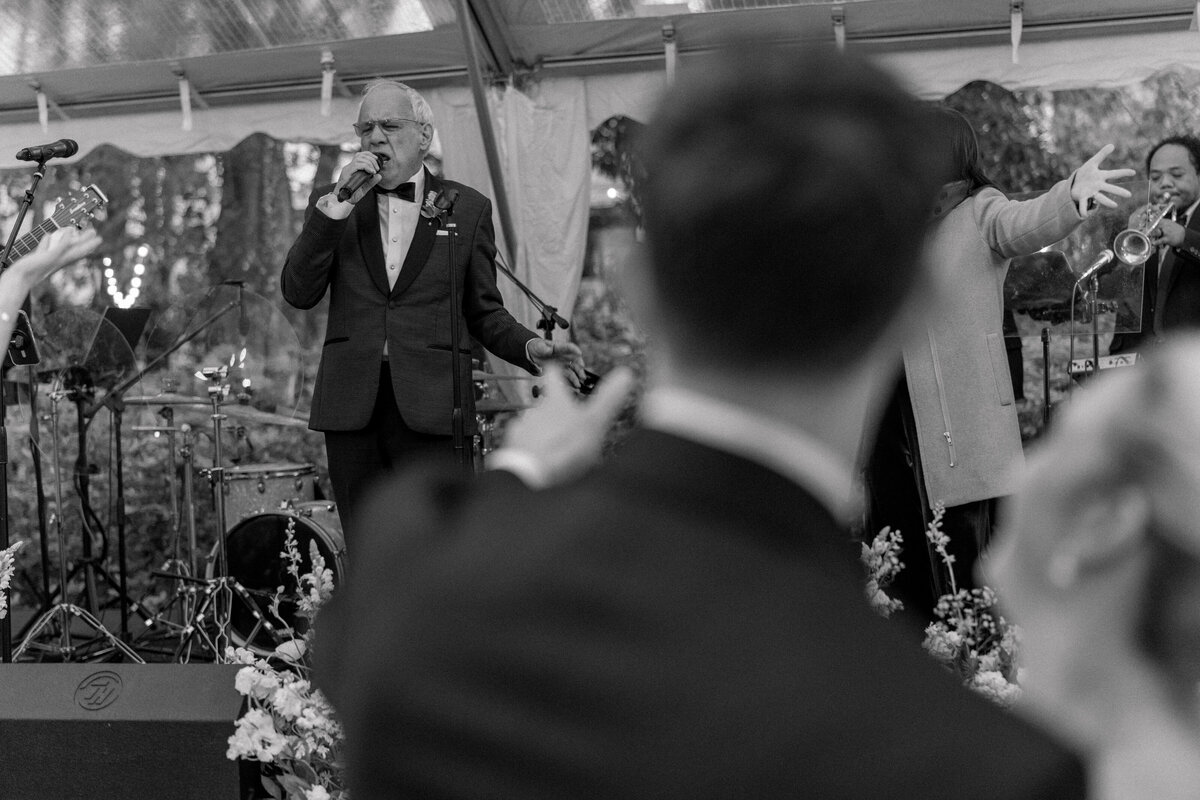 Father of the groom performs New York New York with live band at Charleston destination wedding.