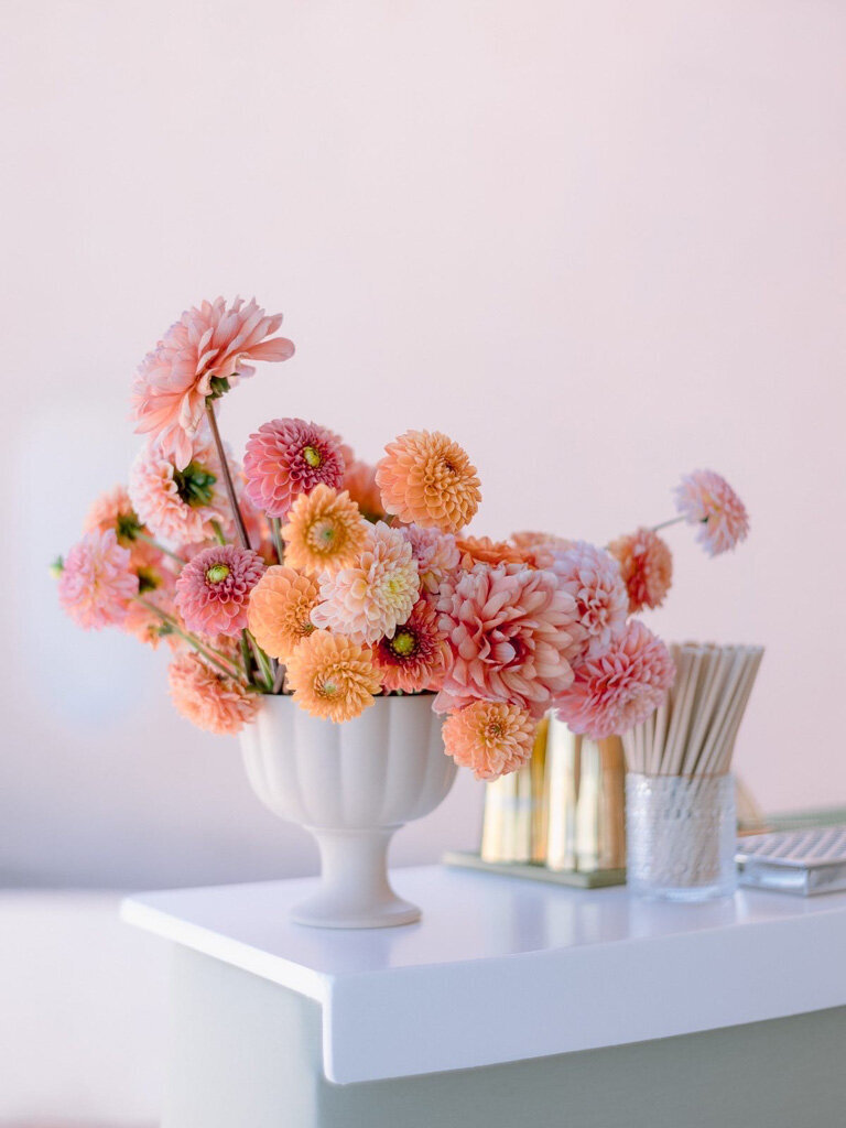 peach dahlia centerpiece on bar