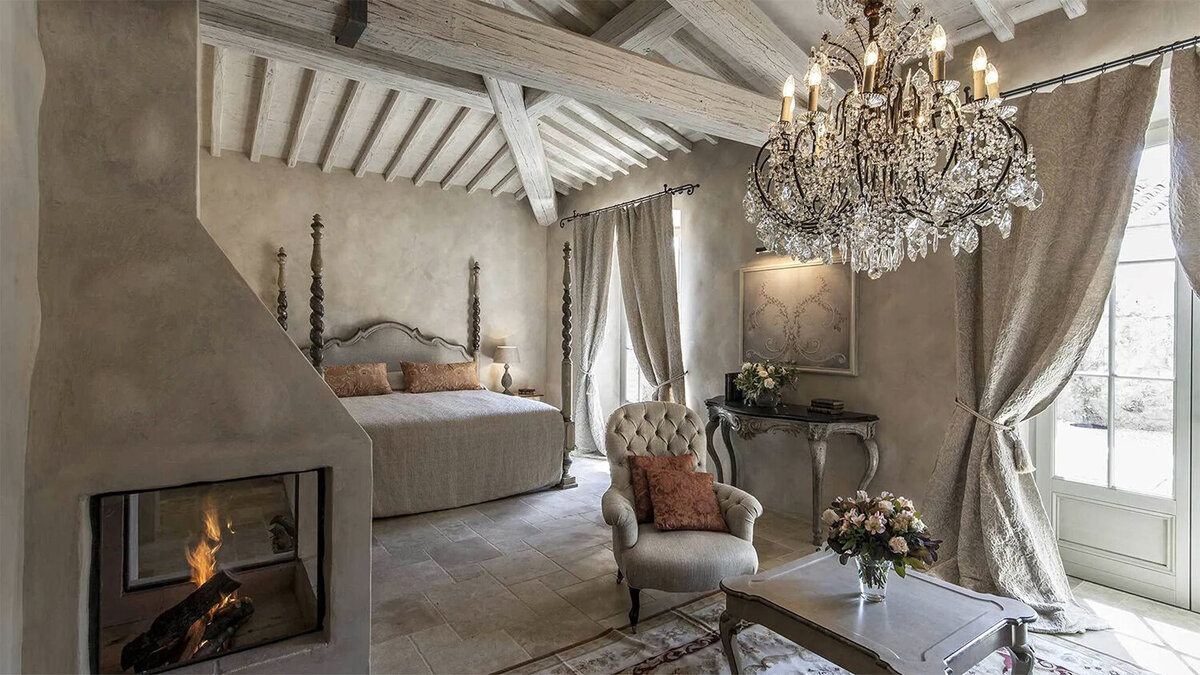 A classically elegant styled bedroom at Borgo Santo Pietro in the Tuscany countryside