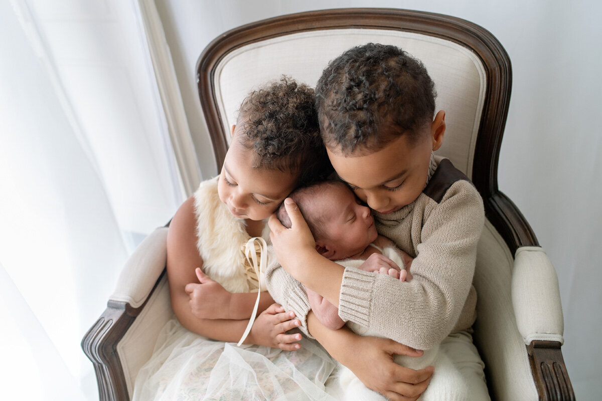 Newborn session of baby with two older siblings