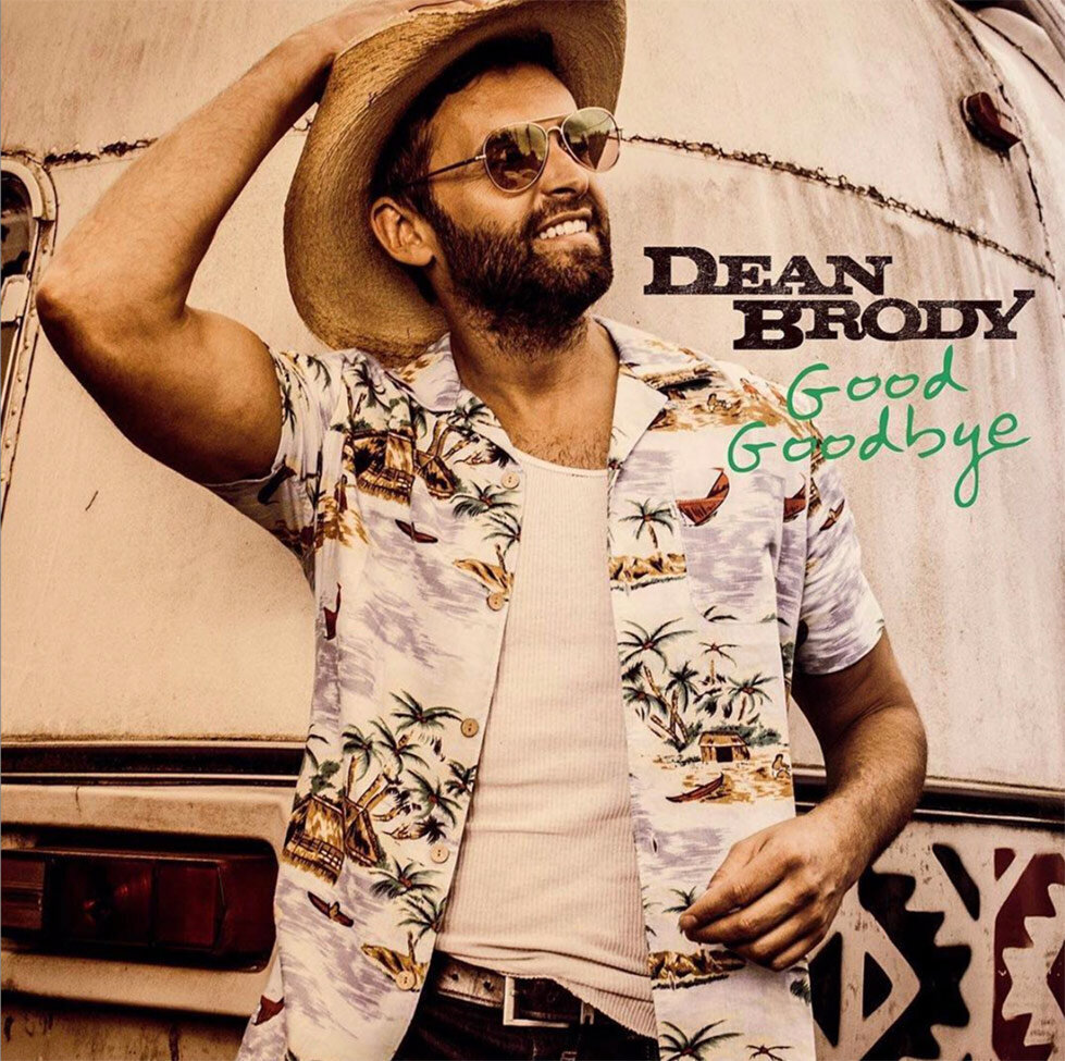 Single Cover Nashville Title Good Goodbye Country Artist Dean Brody standing in front of old trailer hand on his straw cowboy hat sunglasses on
