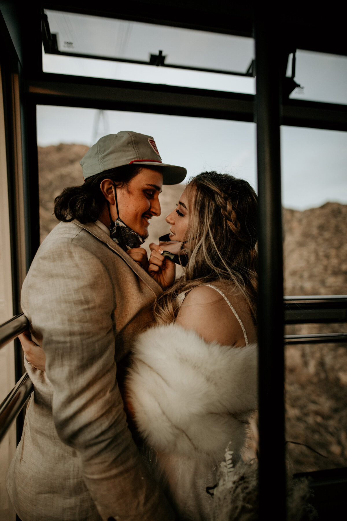 Bride and Groom Riding Sandia Peak Tram after mountain top elopement