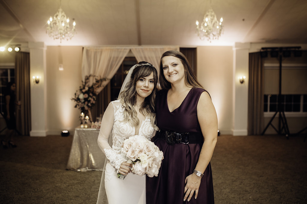 Wedding Photograph Of Bride and Woman in Violet Dress Los Angeles