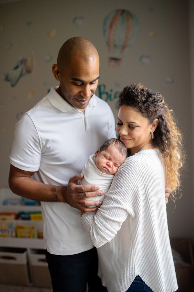 Newborn session of baby with parents