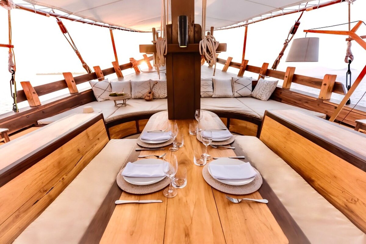 Senja Luxury Yacht Charter Indonesia _lowdef_dining _ chill area_dining_sunset_landscape 4