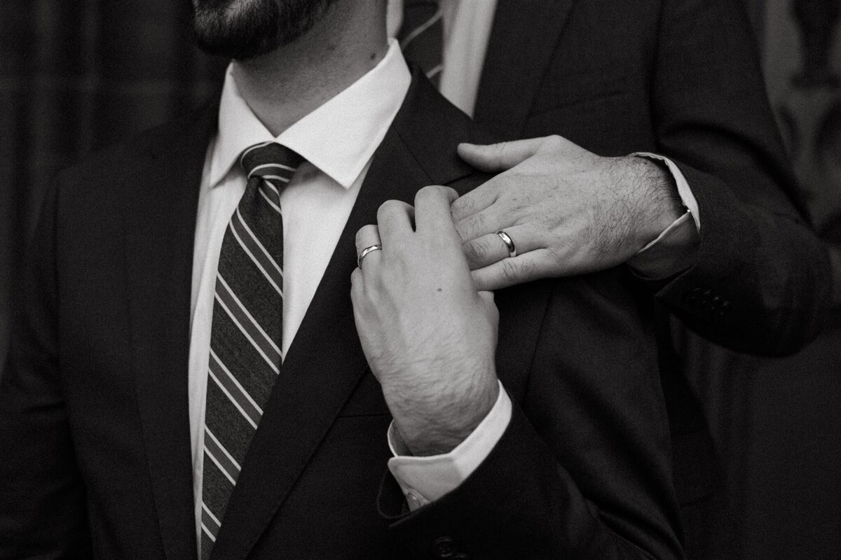 grooms holding hands during new york wedding photos