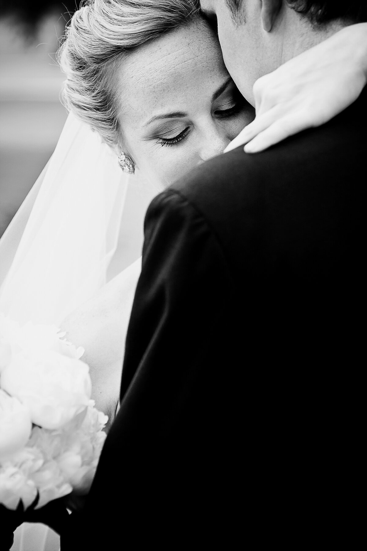 A Bride and Groom embrace at the Broadmoor