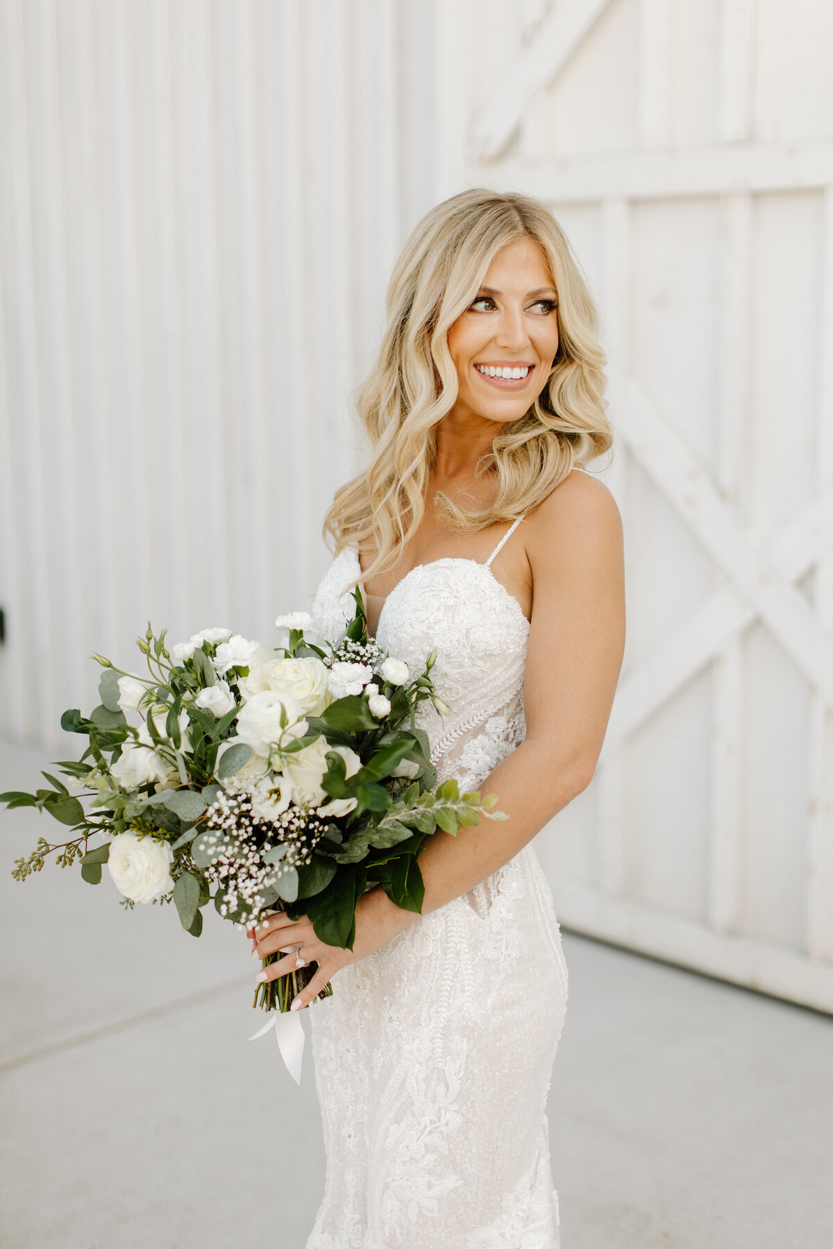 Bride with ivory and greenery bouquet