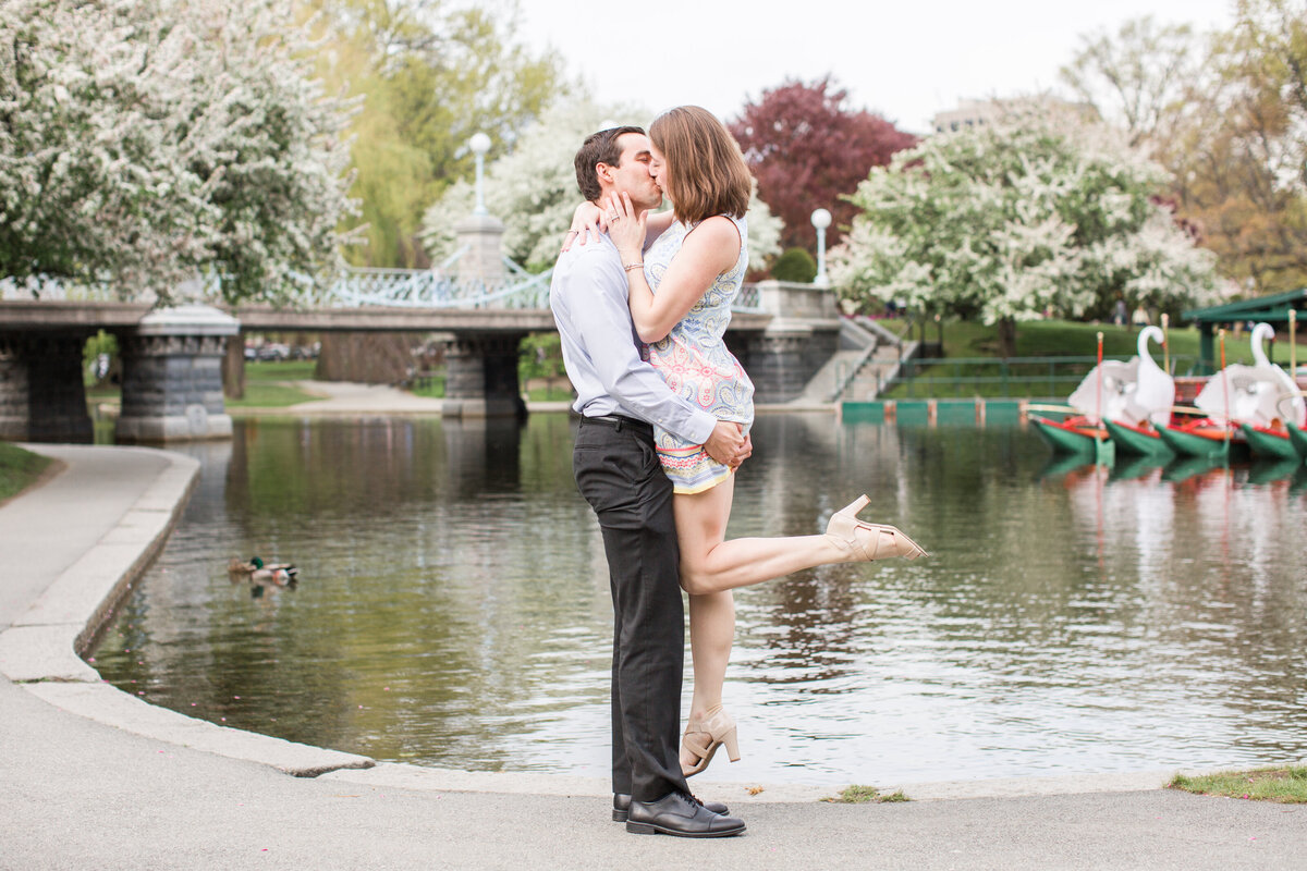 couple kissing in Boston Public Garden in Spring