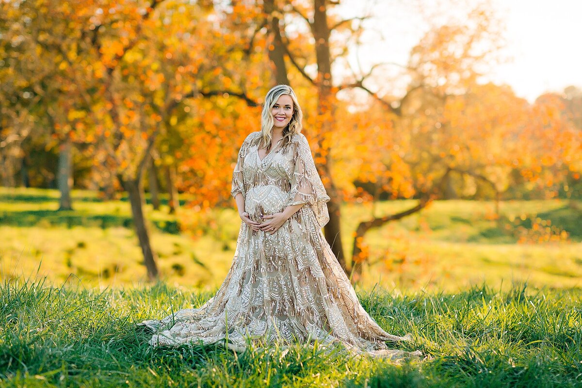 Pregnant woman in a field maternity photoshoot Harrisonburg