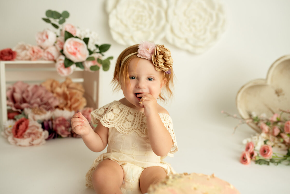 First birthday milestone session flowers and hearts