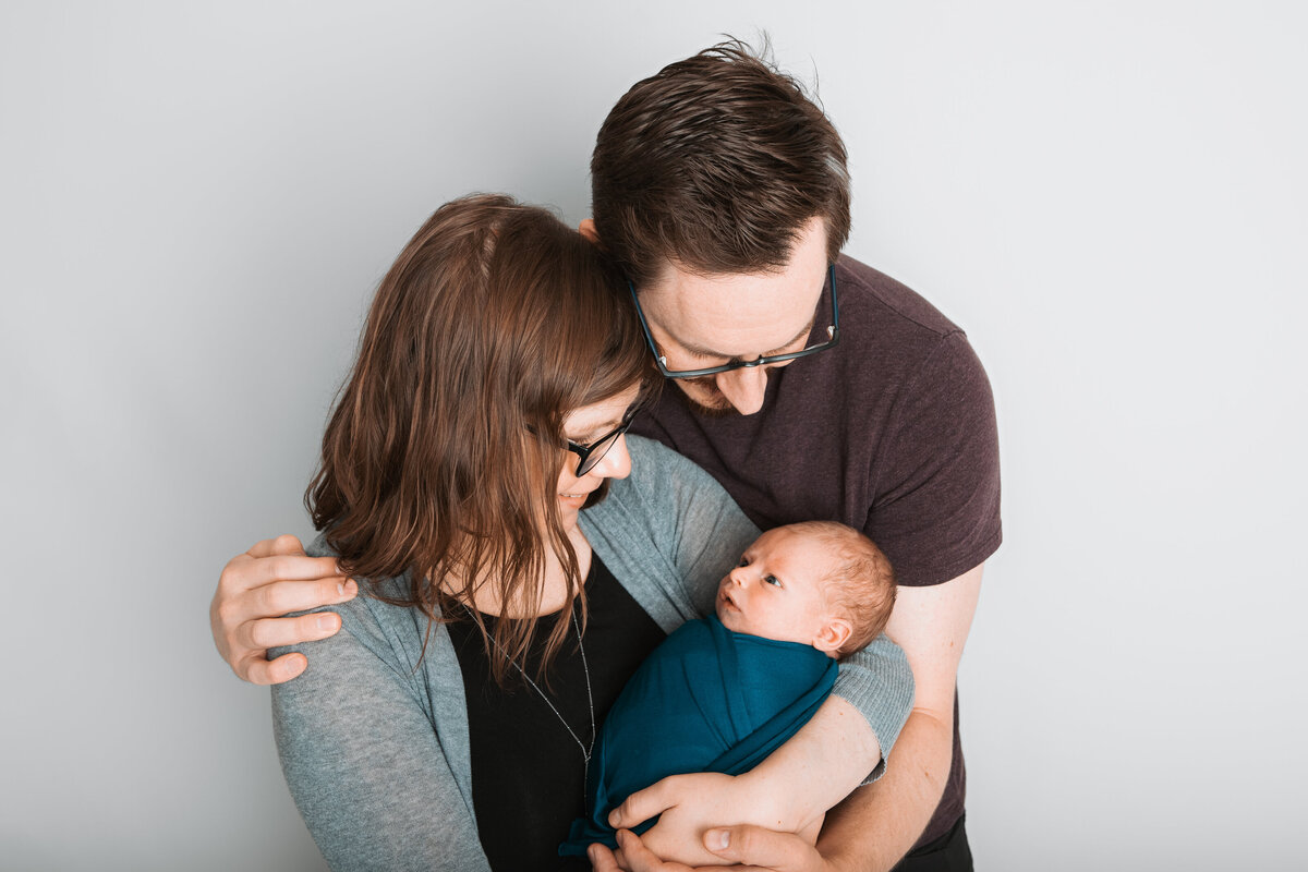 Edmonton couple posing with newborn baby