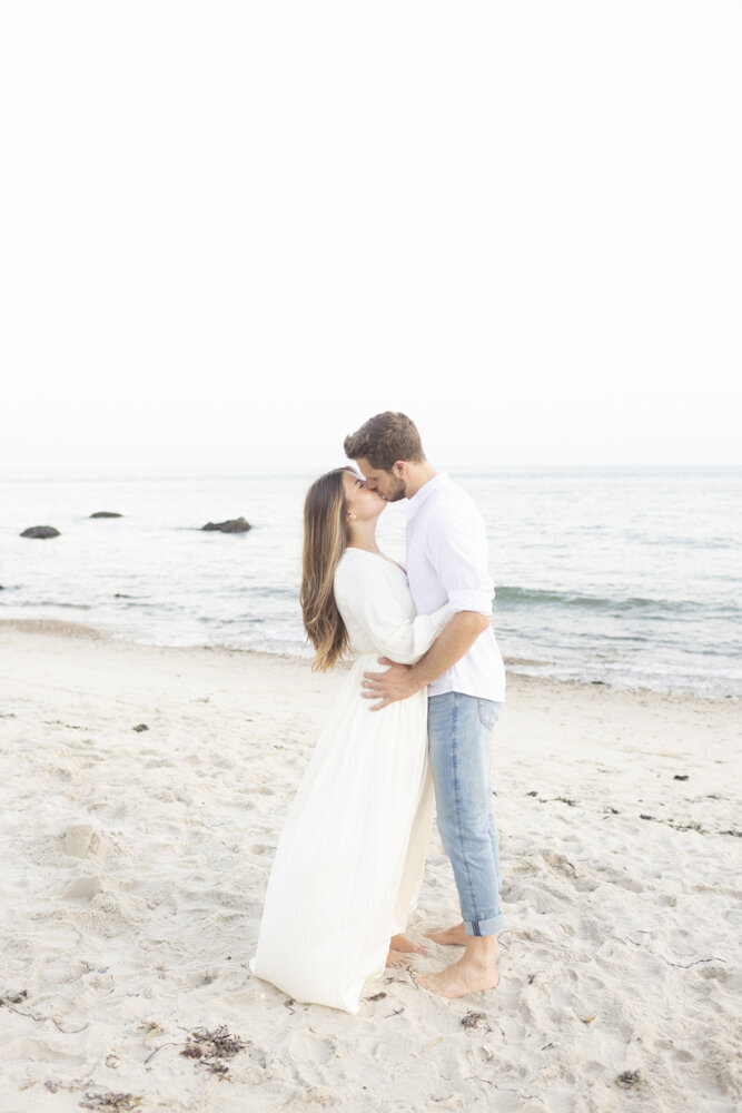 couple kissing in the sand, Harkness Park engagement session