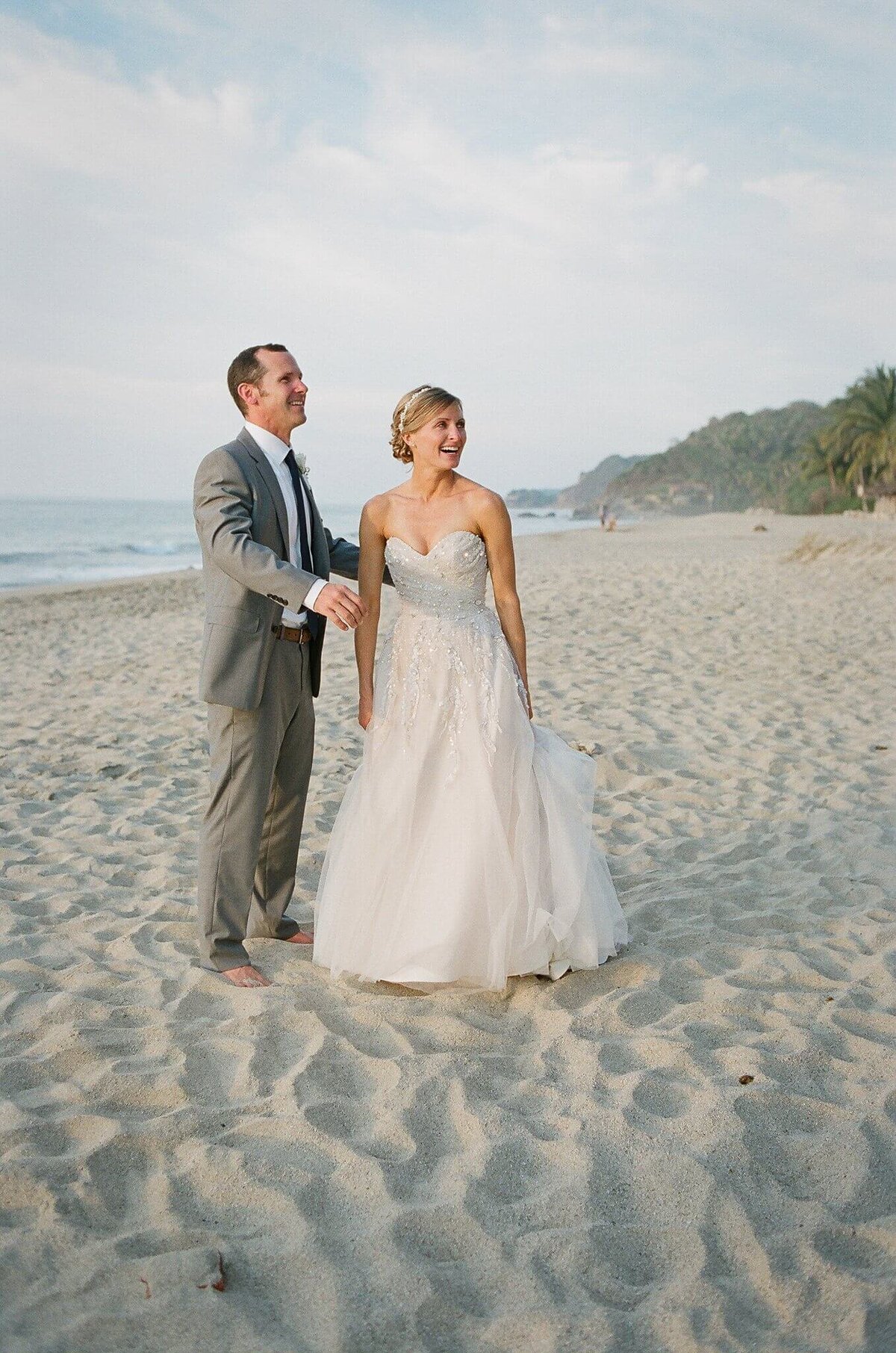 newlyweds on beach in Mexico wedding