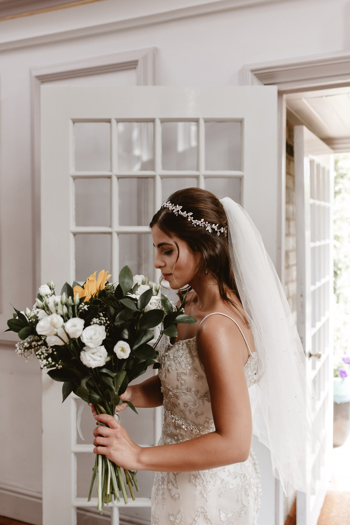 bride smelling her flowers