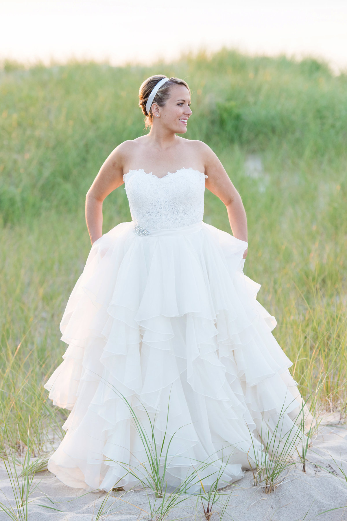 photo of bride walking on the beach from wedding at Pavilion at Sunken Meadow