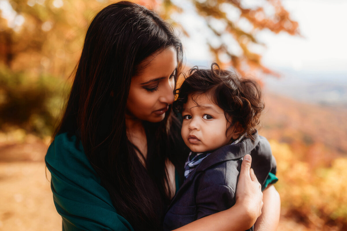Mother embraces her son during Family Photoshoot on the Blue Ridge Parkway in Asheville, NC.
