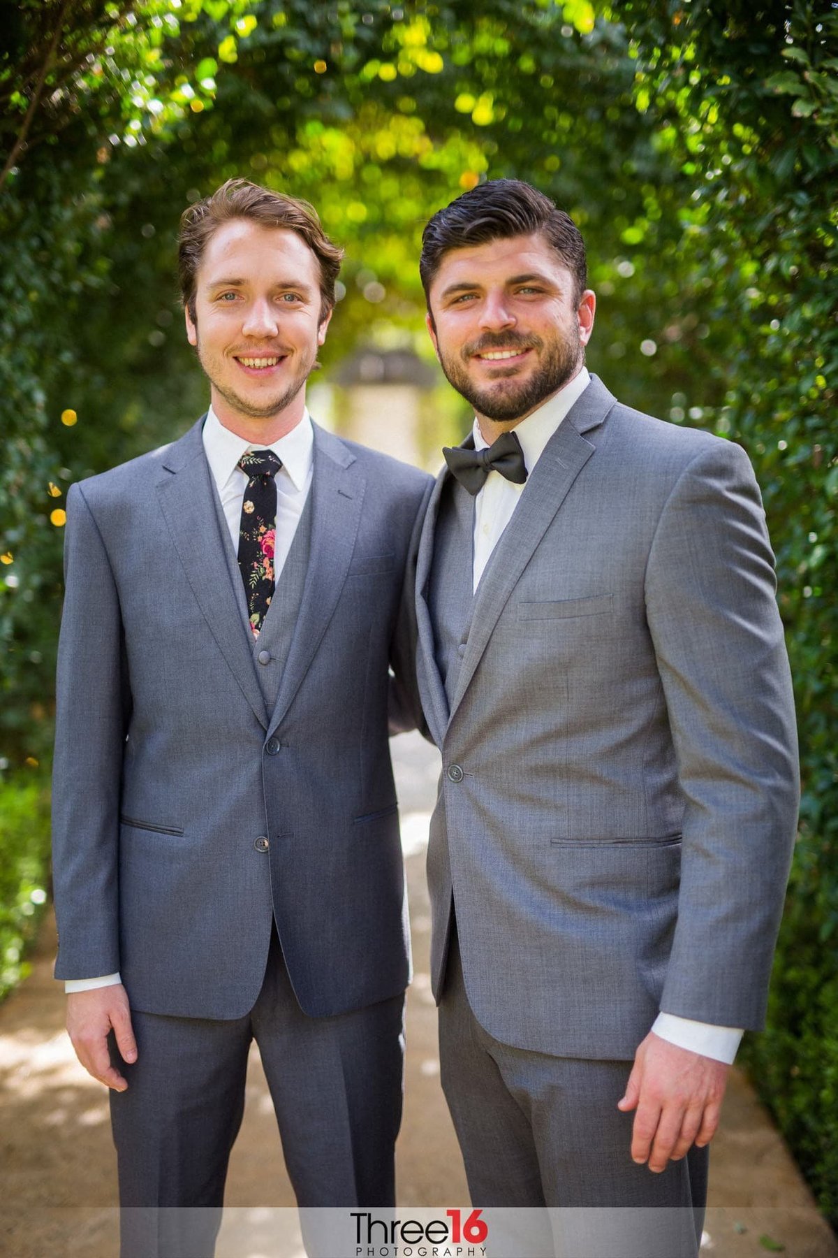 Groom poses with a Groomsman for photos