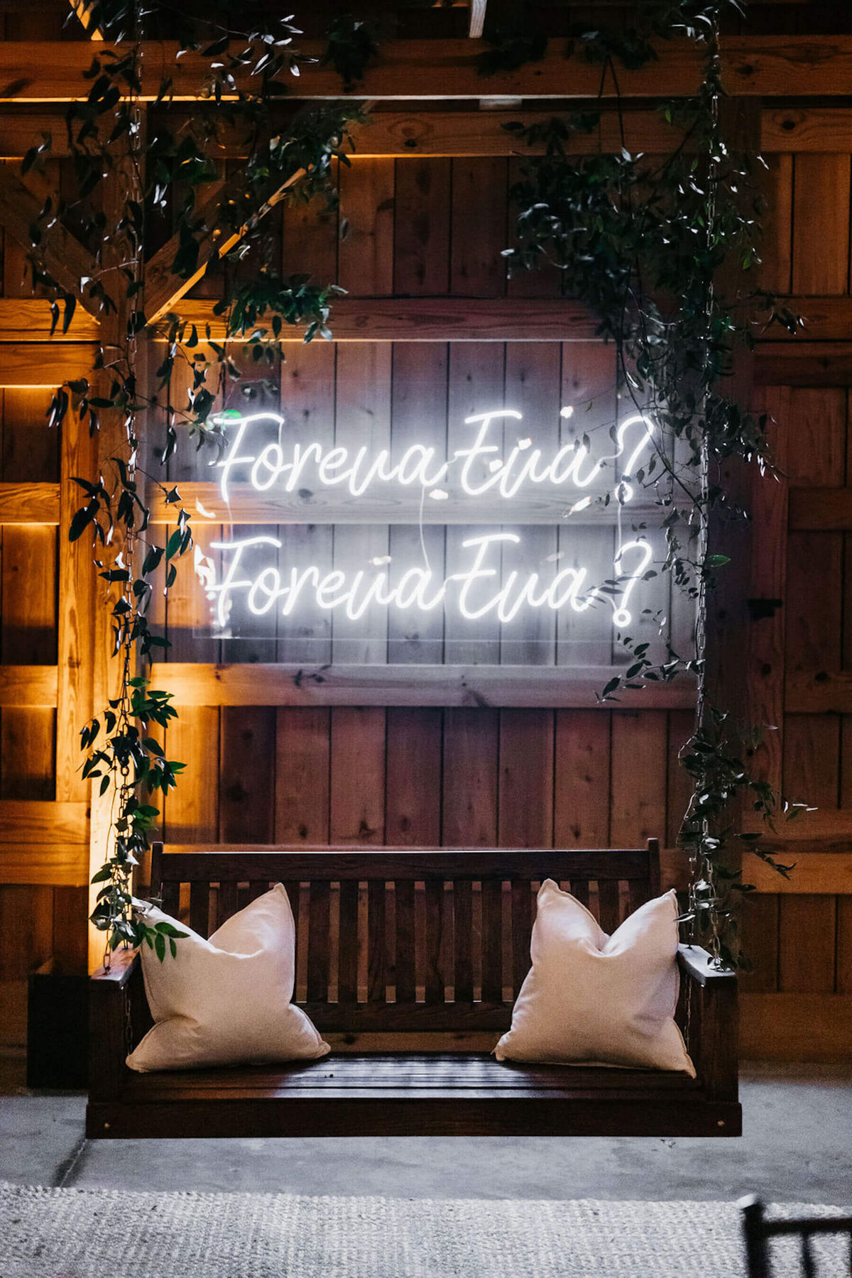 Foreva Eva? white neon acrylic sign at wedding reception