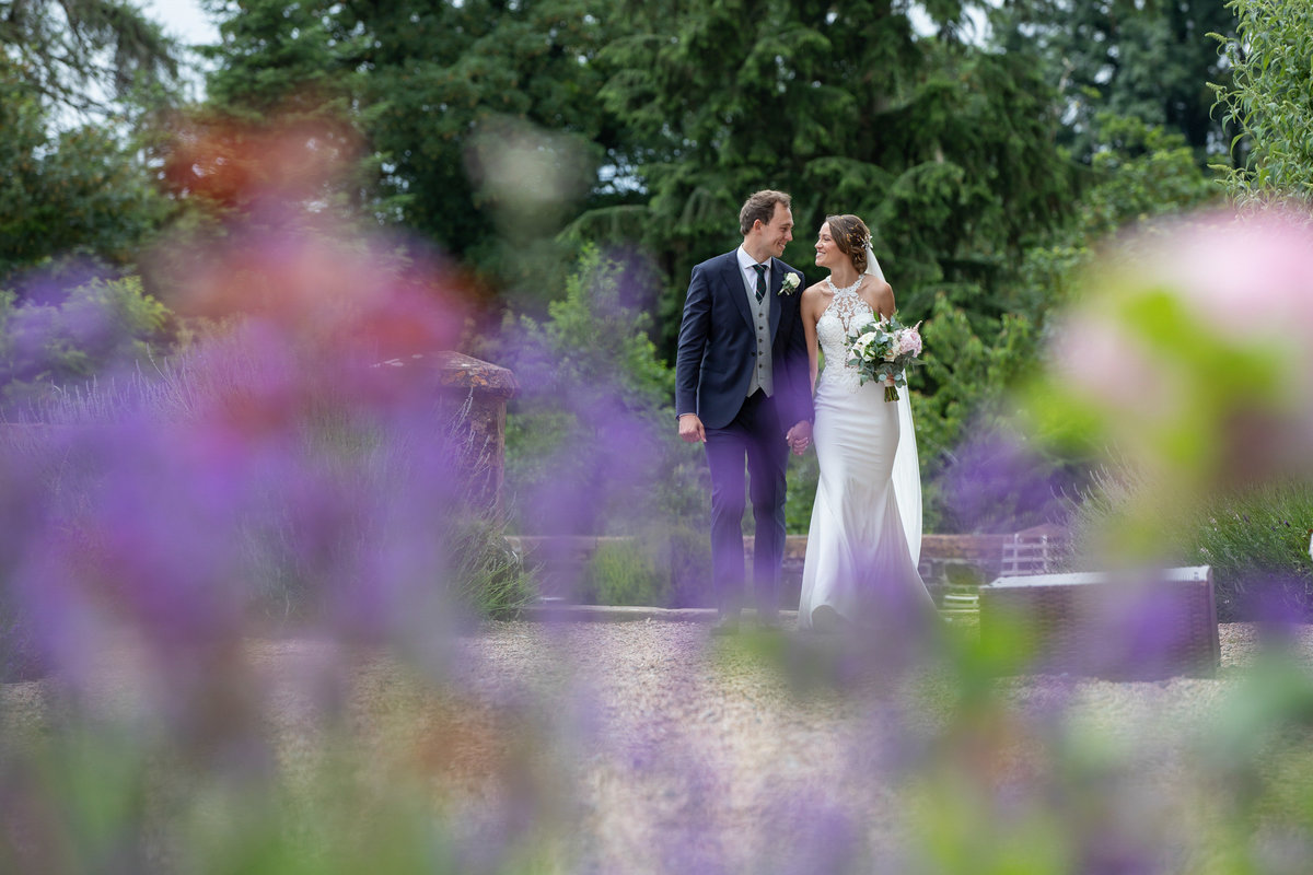 Bride and Groom in the gardens at Huntsham Court Wedding Devon_