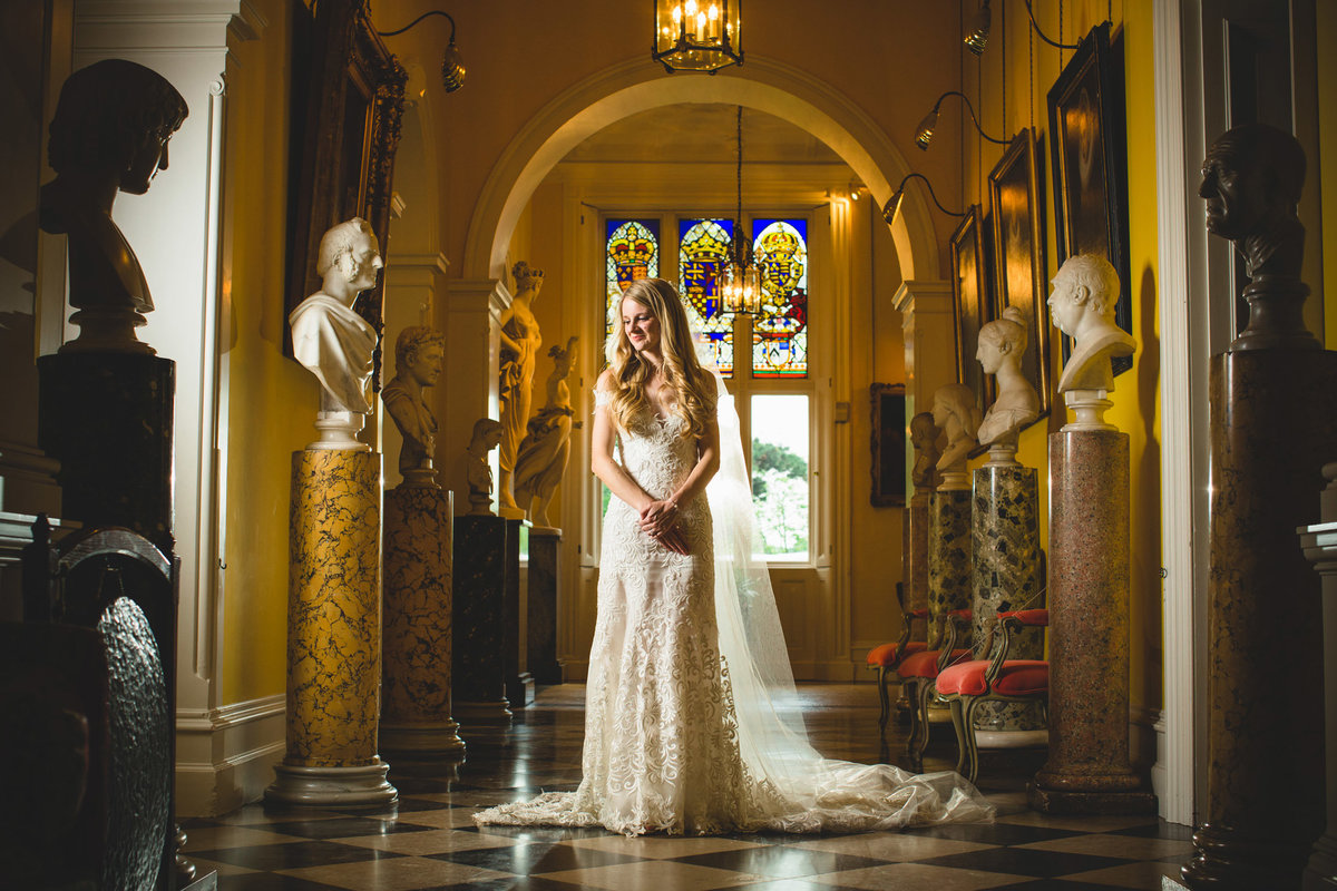a bride stood in the hallway at capesthorne hall