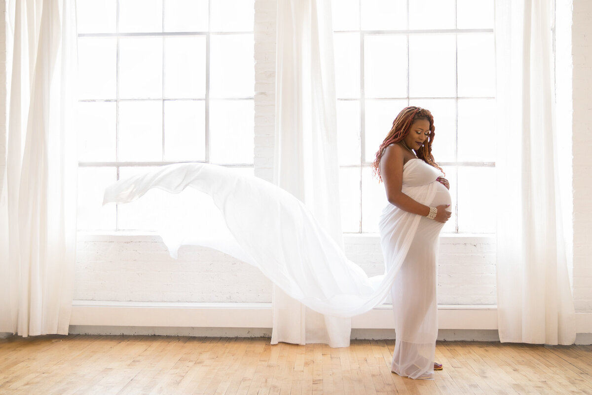 woman-with-flowing-white-maternity-gown