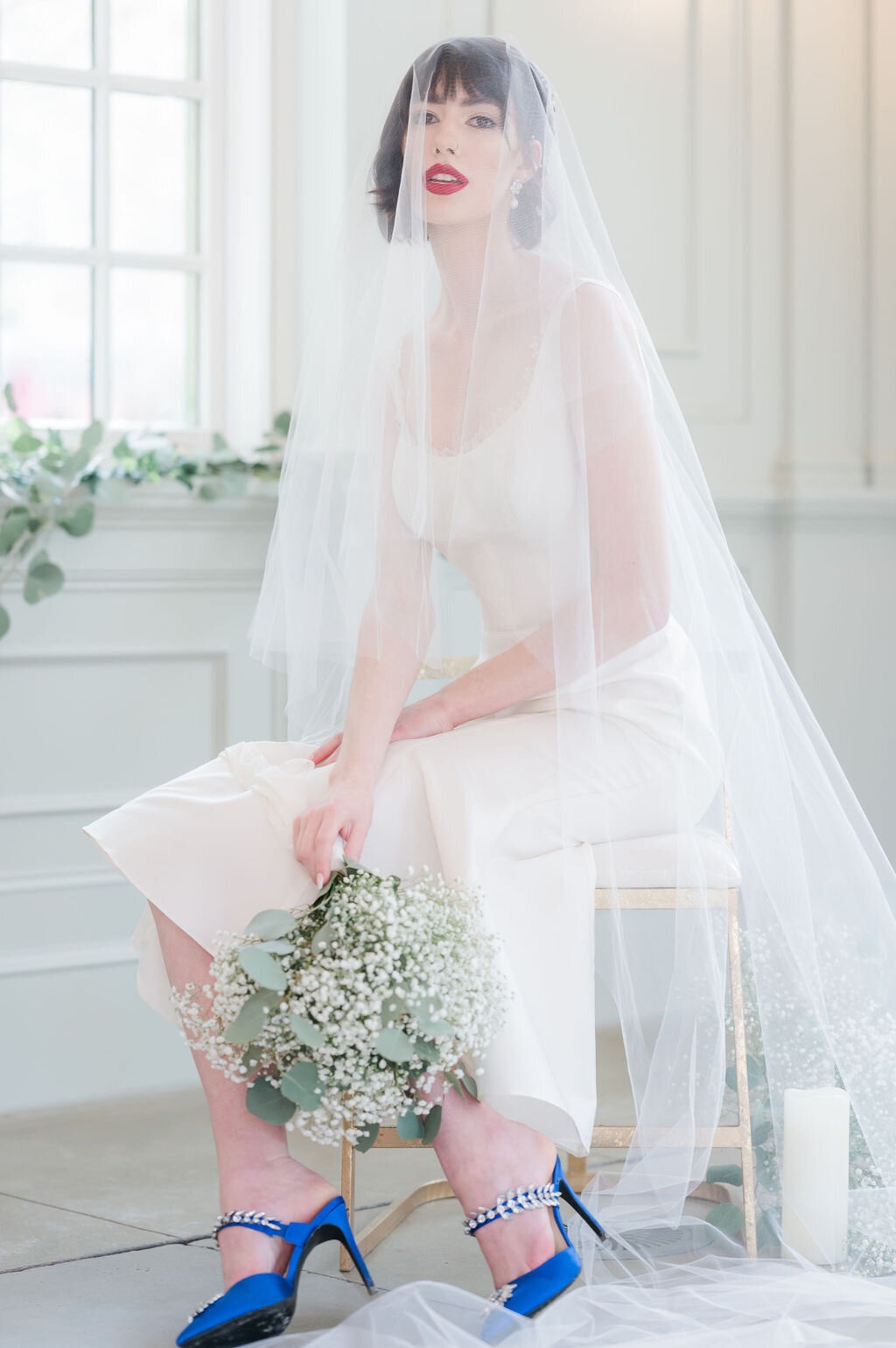 The foldover blusher of the mantilla-style Orchids veil drapes over the head for a dramatic and romantic look.