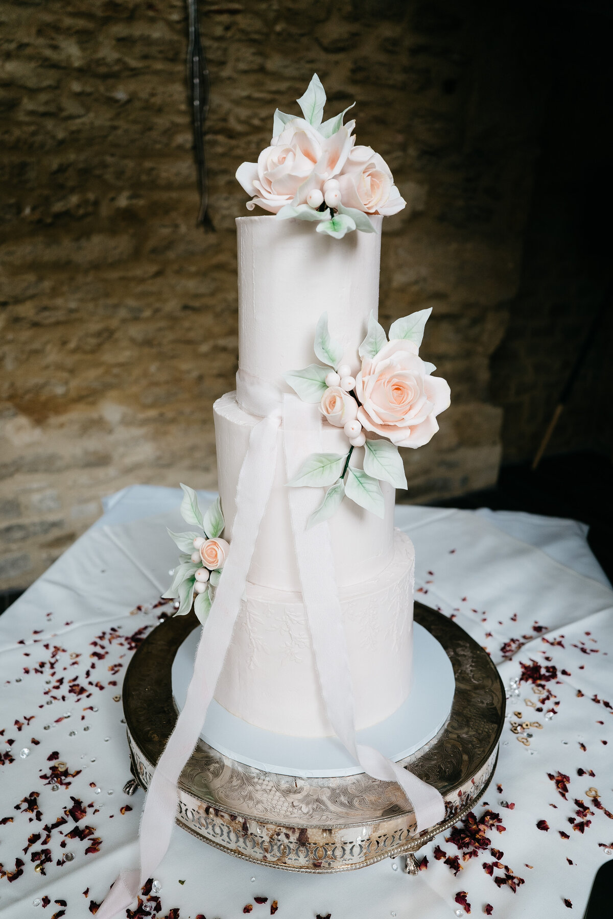 Blush wedding cake with silk ribbon and sugar flowers ruses