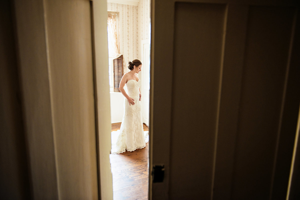 A peak through the door of a bride getting ready for her wedding at the Rosebank Winery.