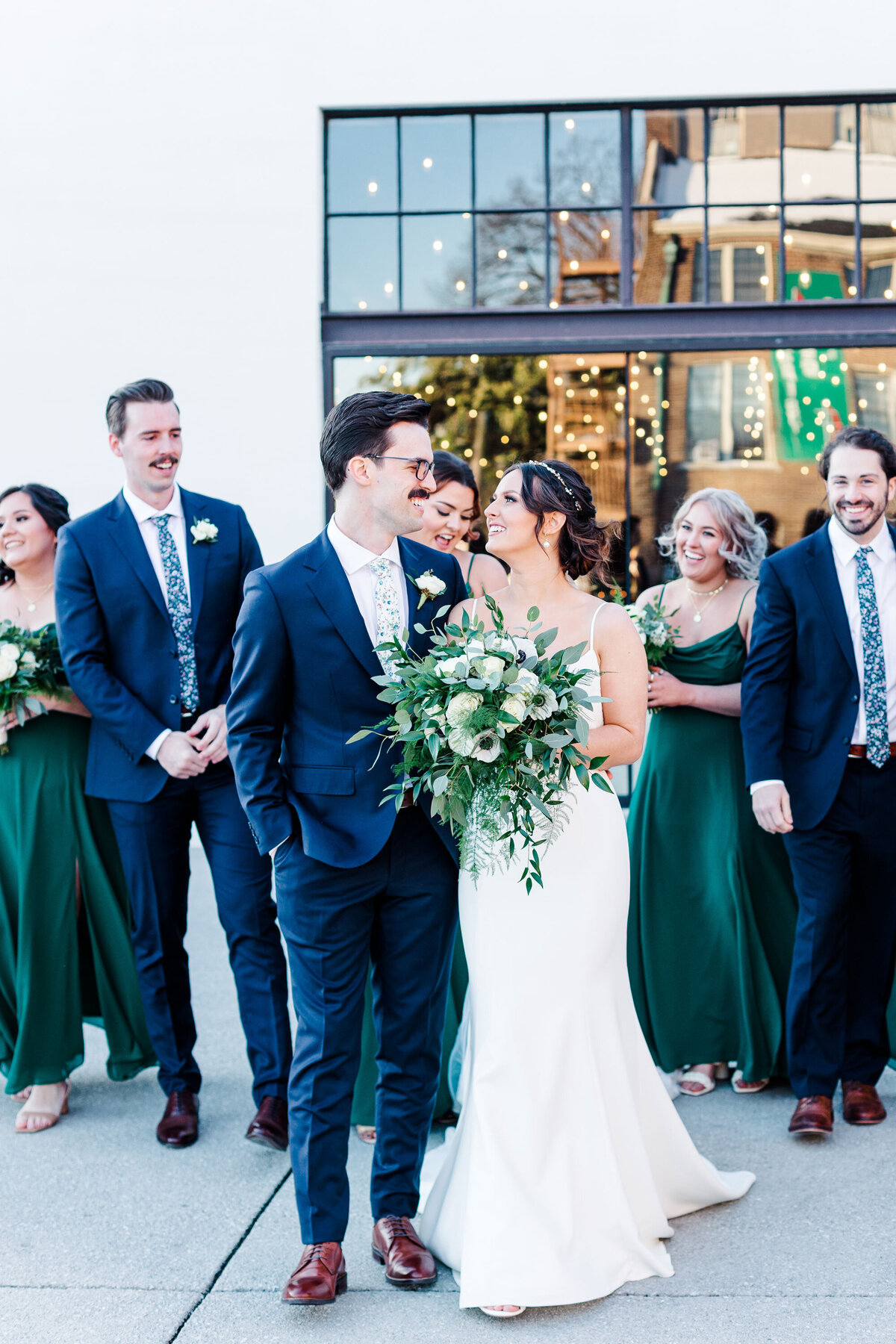 wedding couple and bridal party walking together