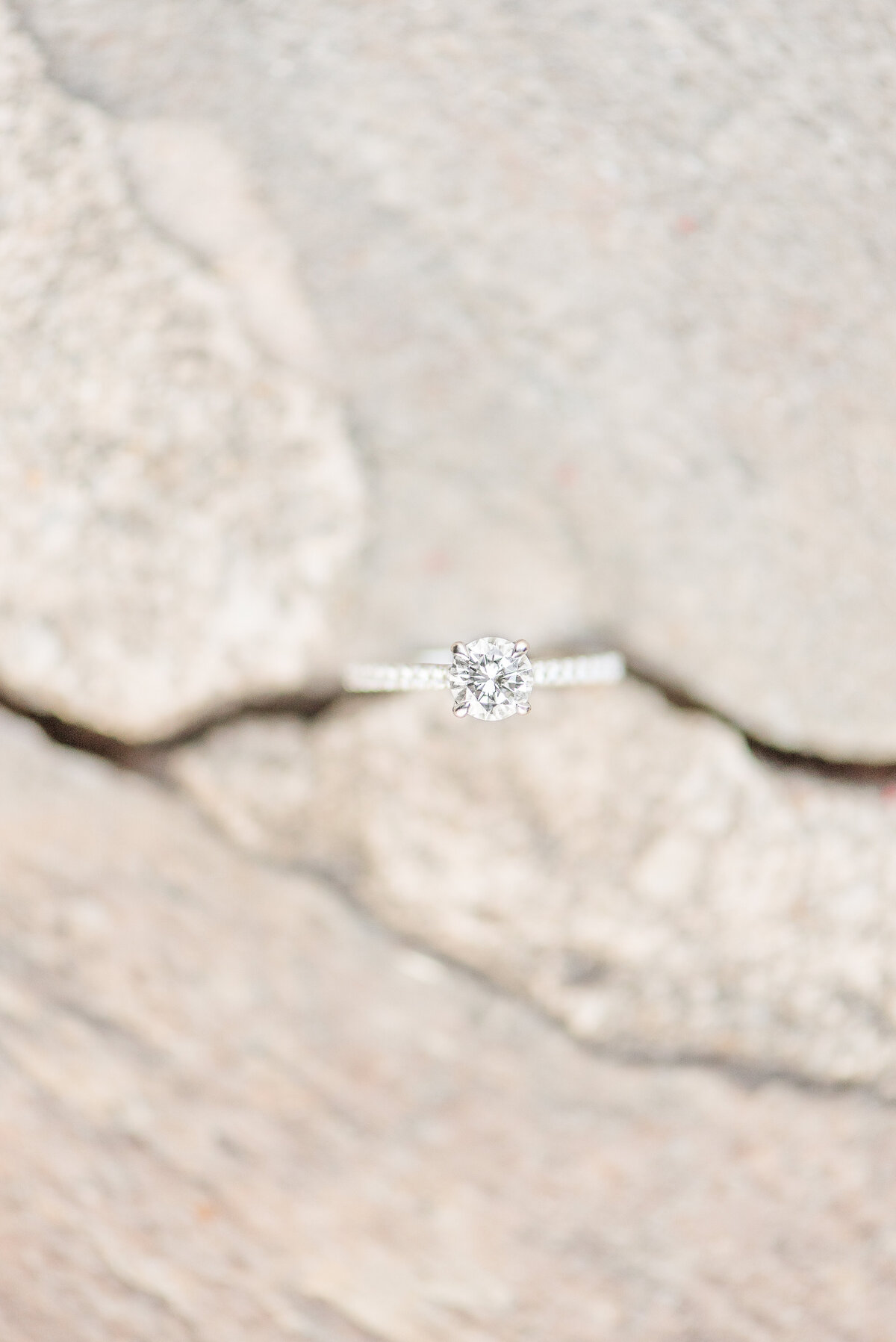 engagement ring on  stone slate
