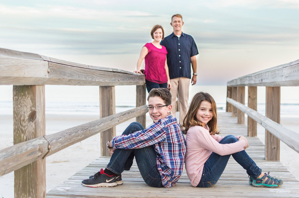 family beach photo on pier