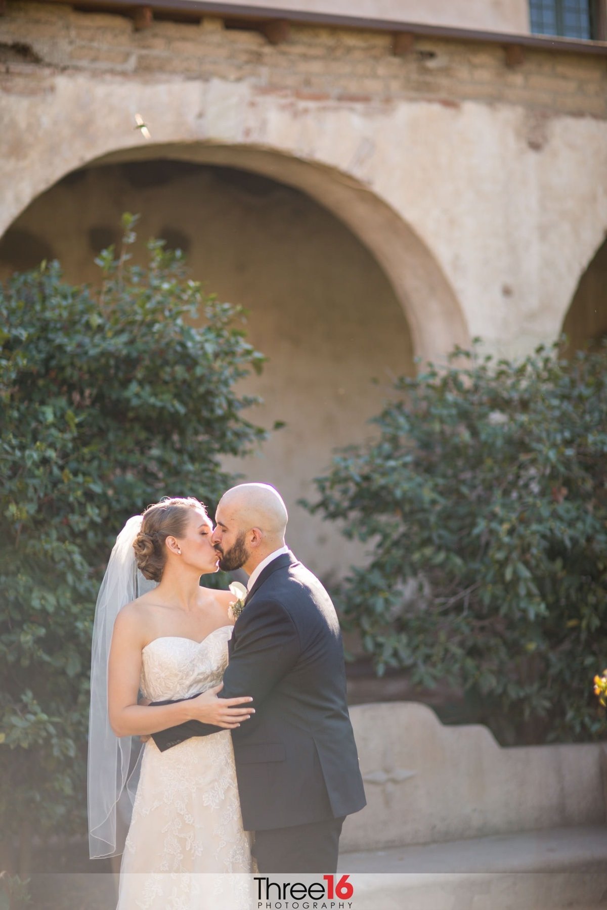Bride and Groom share an intimate kiss after the ceremony during alone time