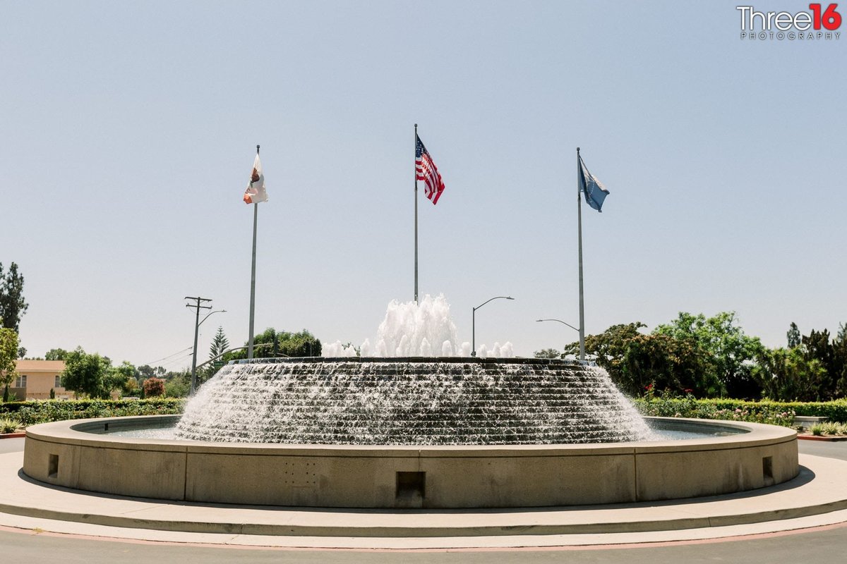 Flags fly high over the water fountain at the Richard Nixon Library