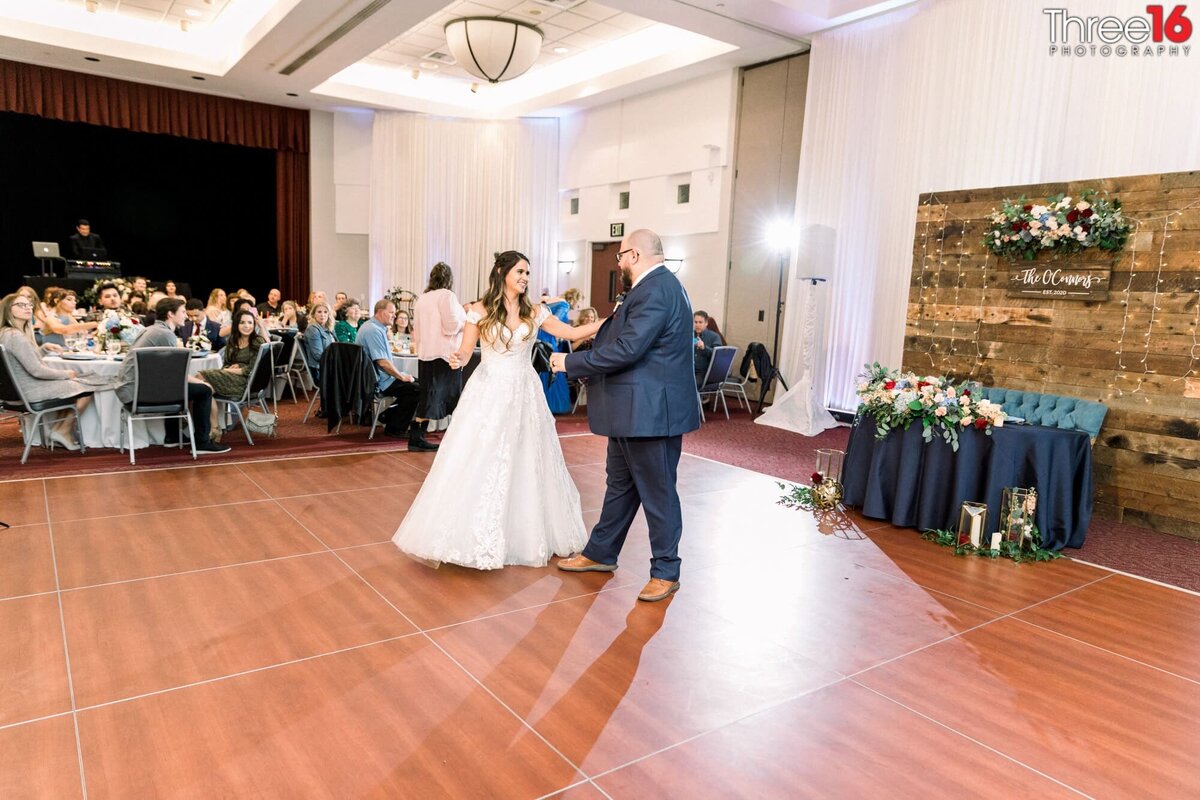 Newly married couple dance their first dance at their Yorba Linda Community Center wedding reception