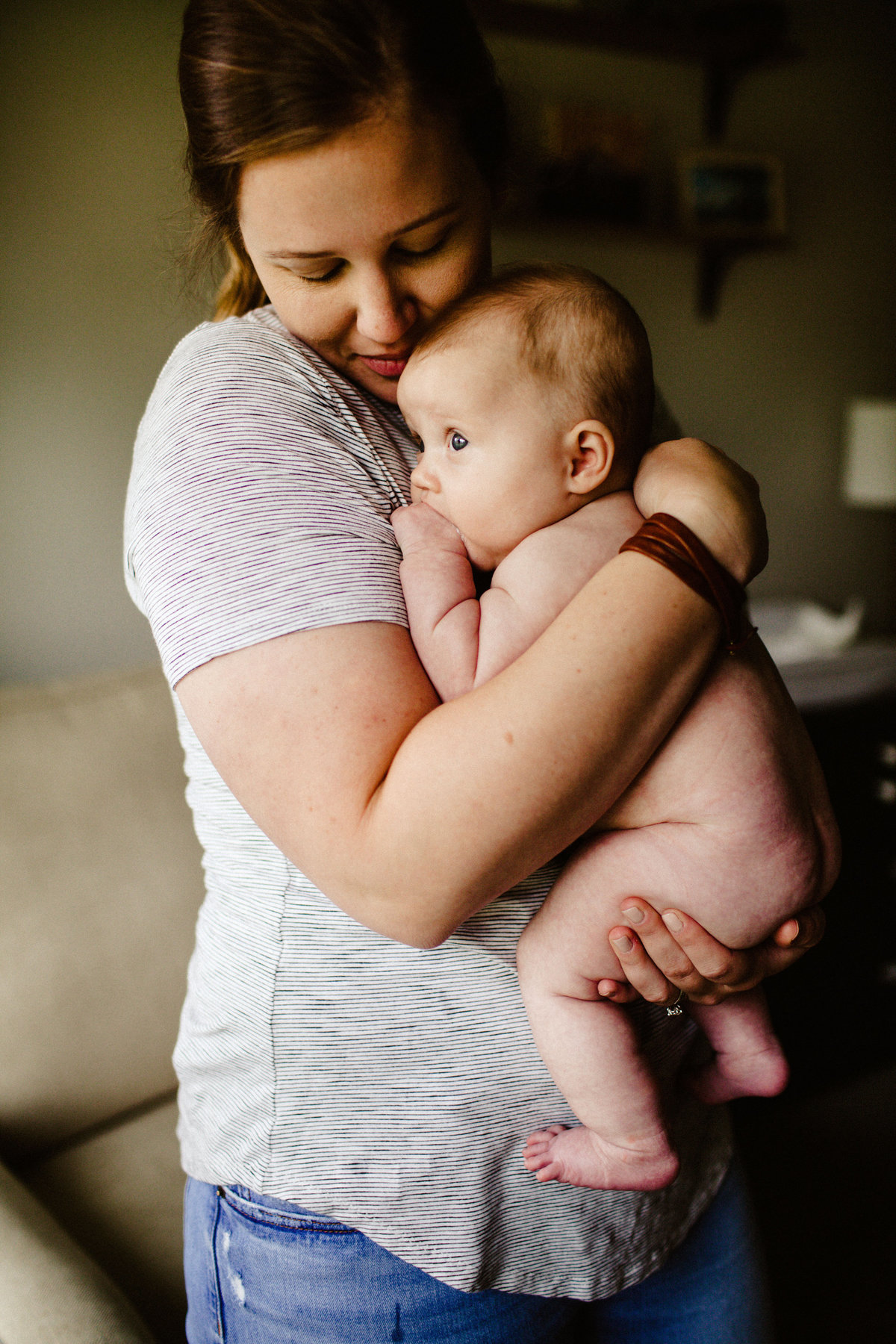 mother holds chubby baby