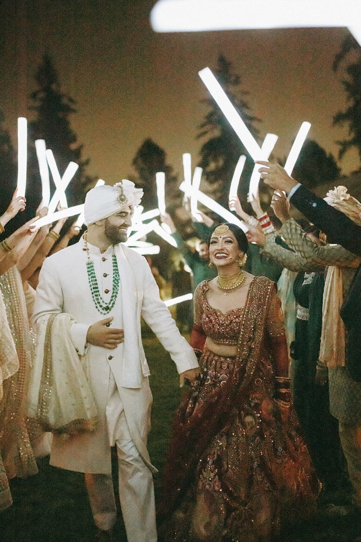 outdoor-garden-hindu-wedding-tent-greenery-bride-groom-glow-sticks