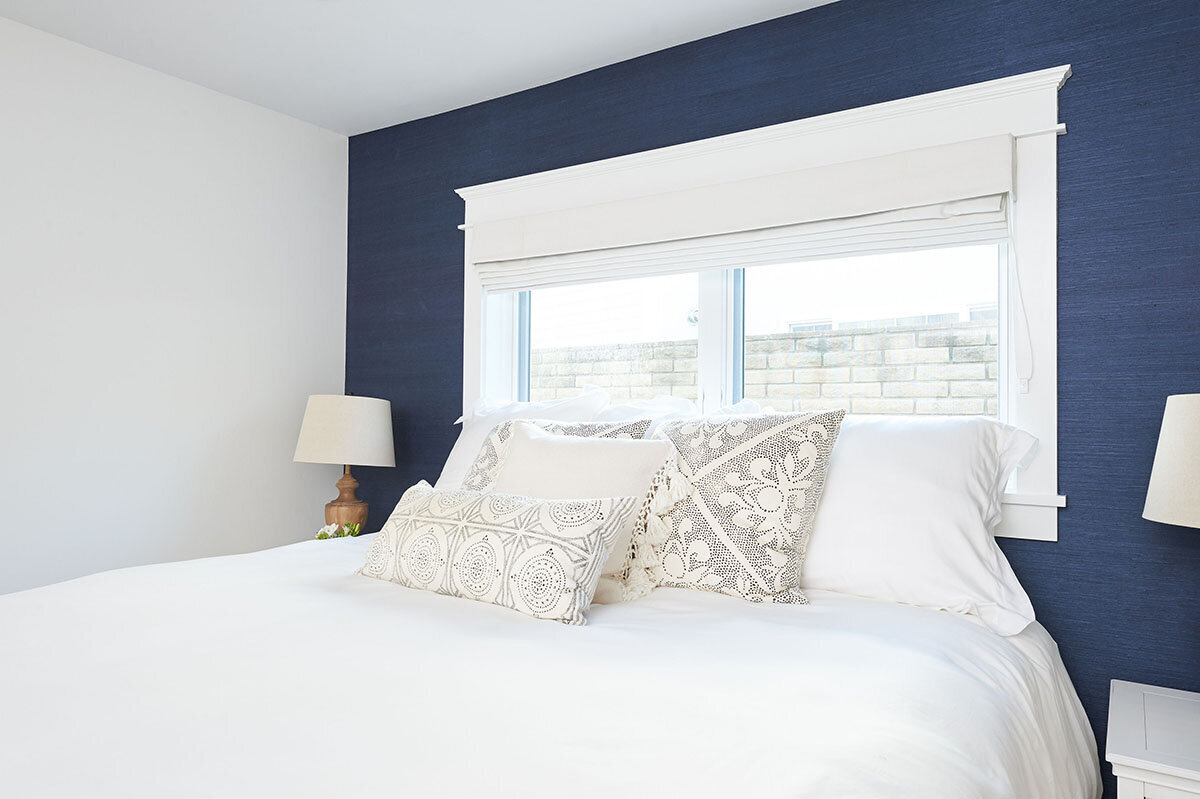 bedroom with navy wallpaper