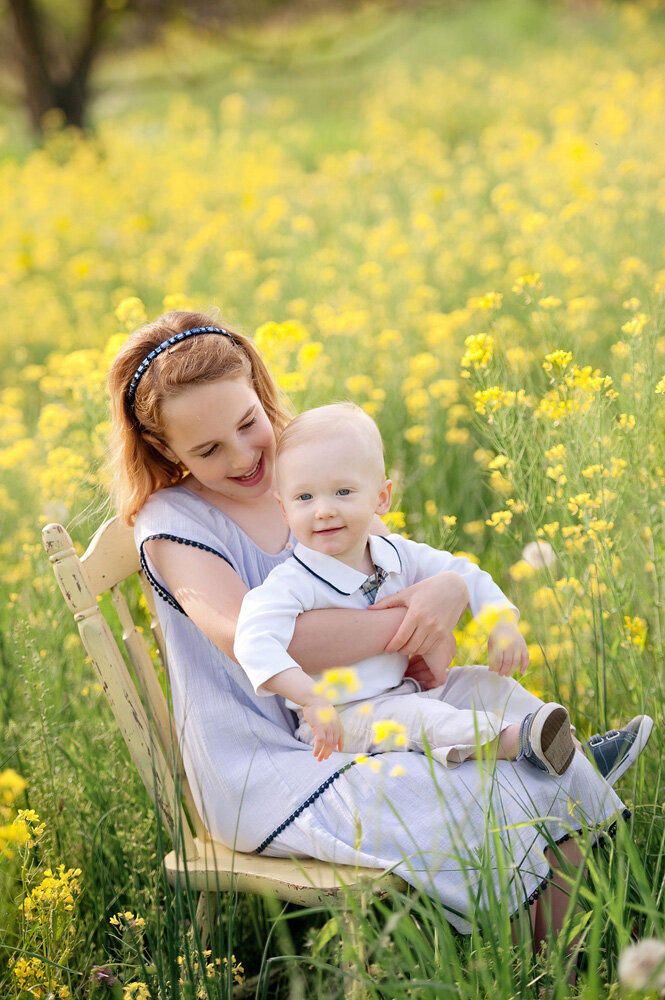 Family session surrounded by yellow flowers