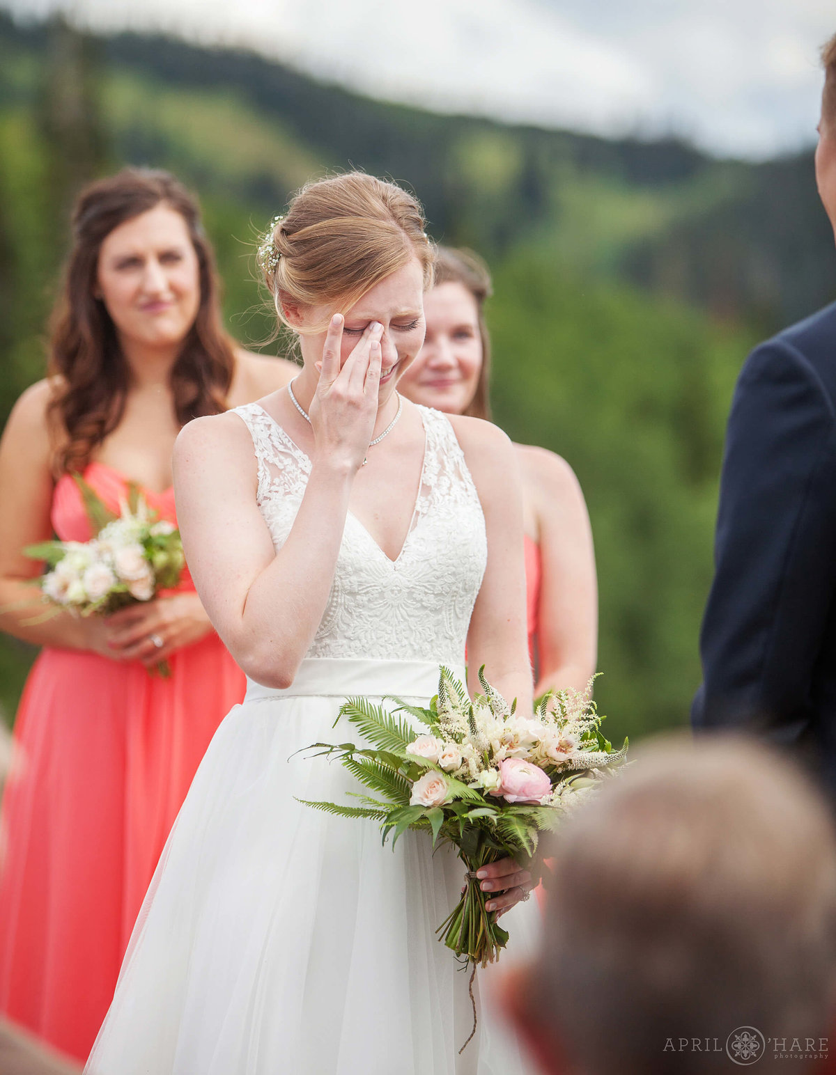 Bride cries at her beautiful outdoor Steamboat Springs Wedding ceremony in Colorado