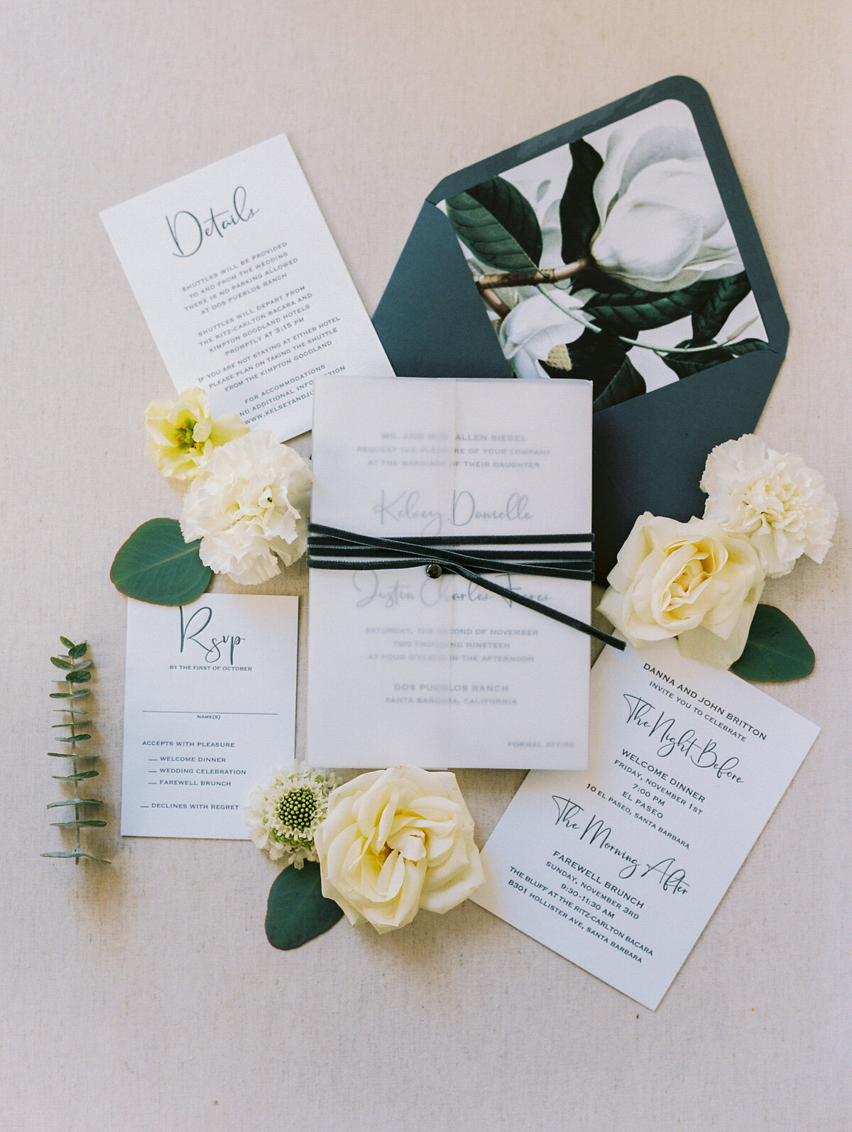 modern invitation with green envelope liner and magnolia blossom design