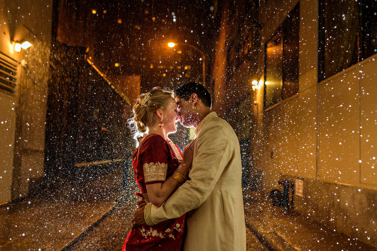 Indian wedding couple caught in the rain after their reception at the Racquet Club of Philadelphia.