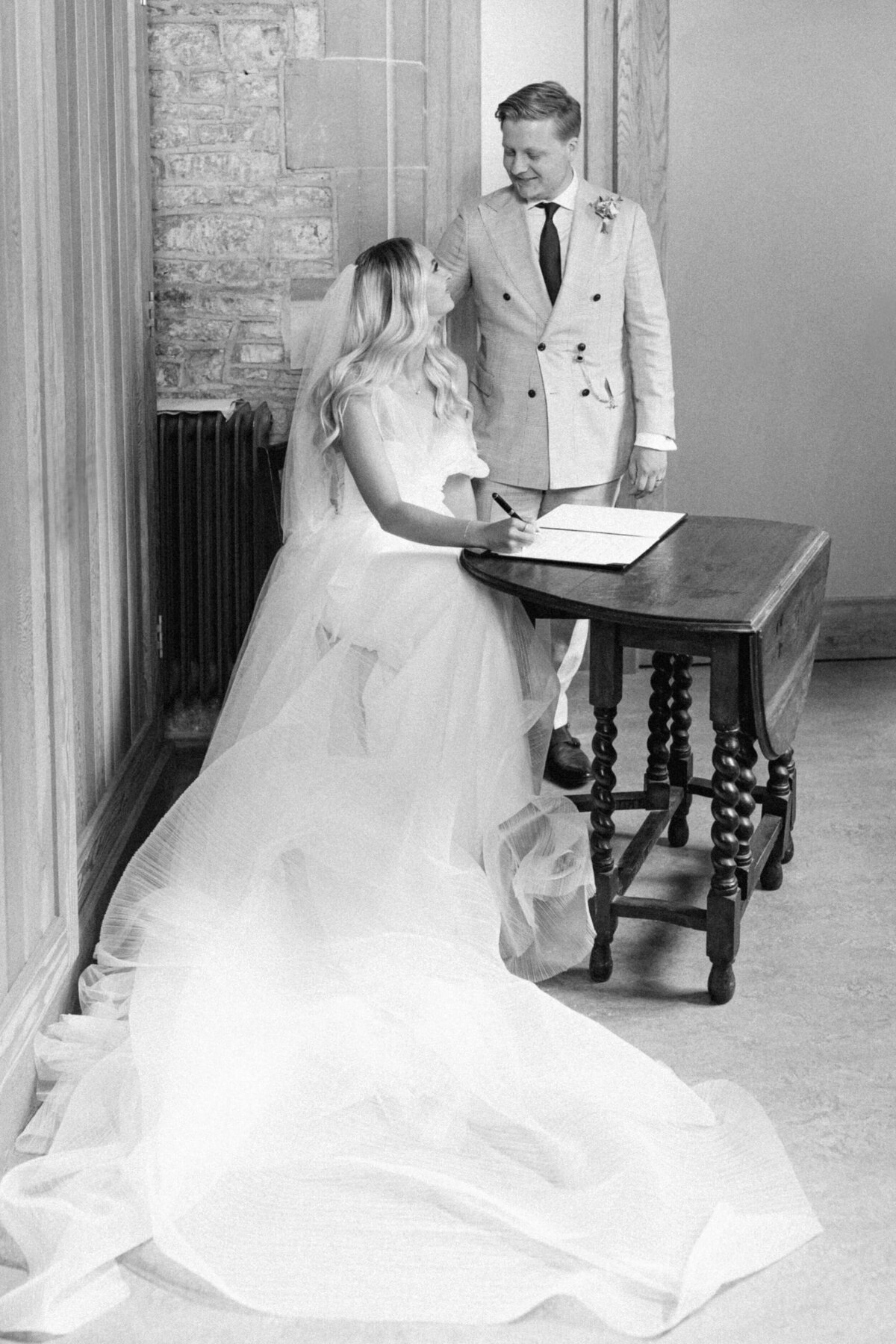 chloe-winstanley-weddings-ceremomy-signing-register-newhite-bridal