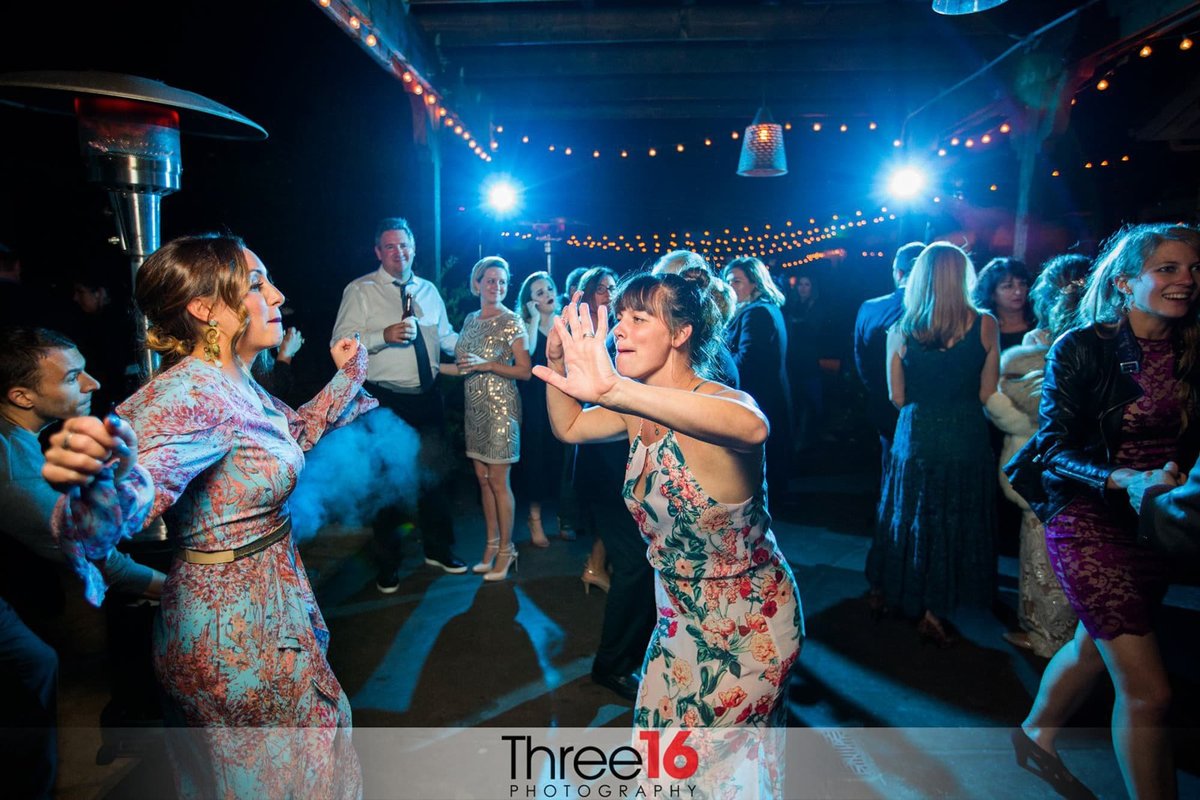 Women dancing at wedding reception