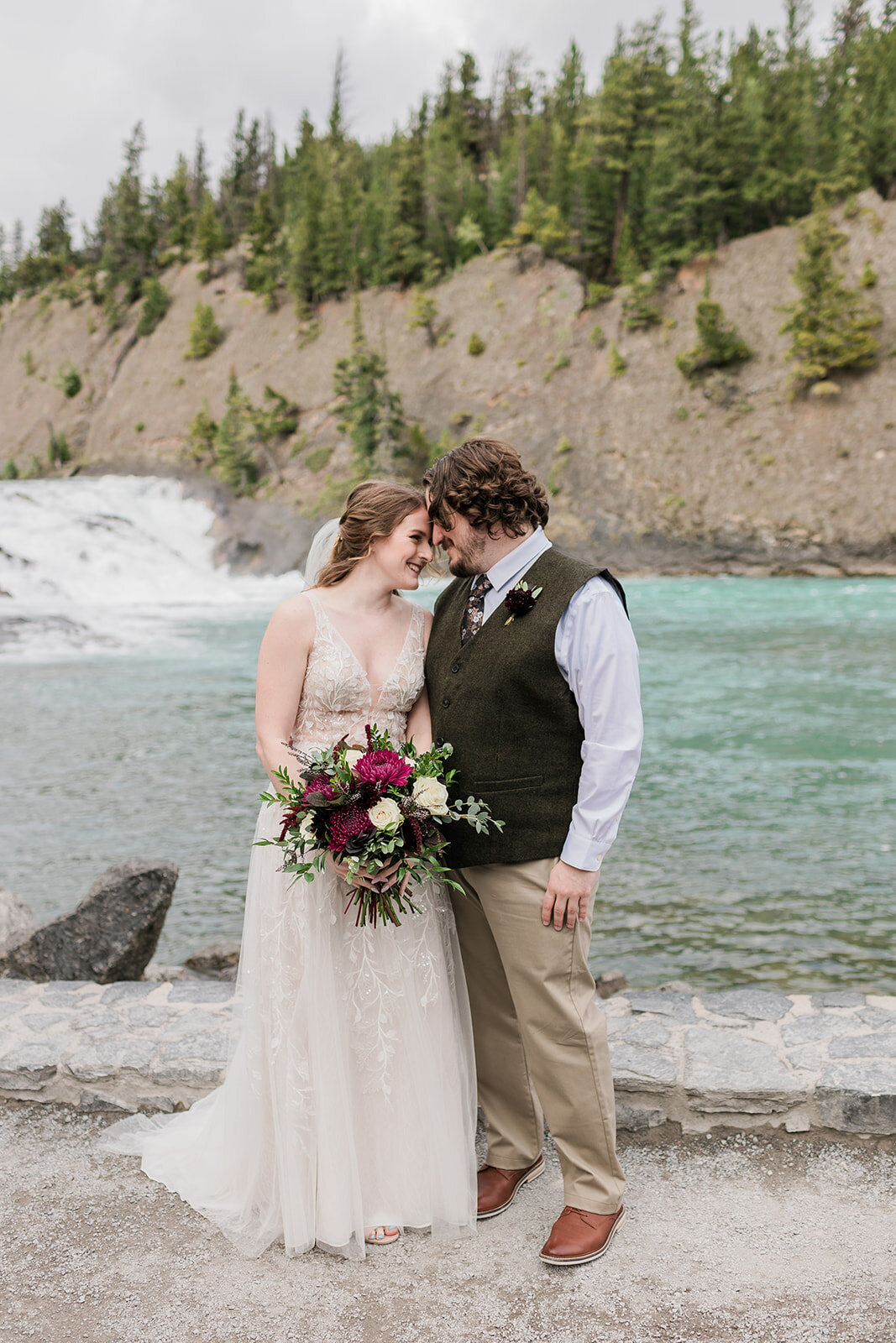 couple touching foreheads after wedding in the rocky Mountains