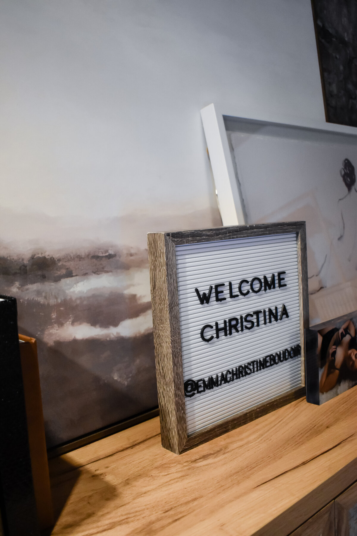 A small letter board reads welcome christina