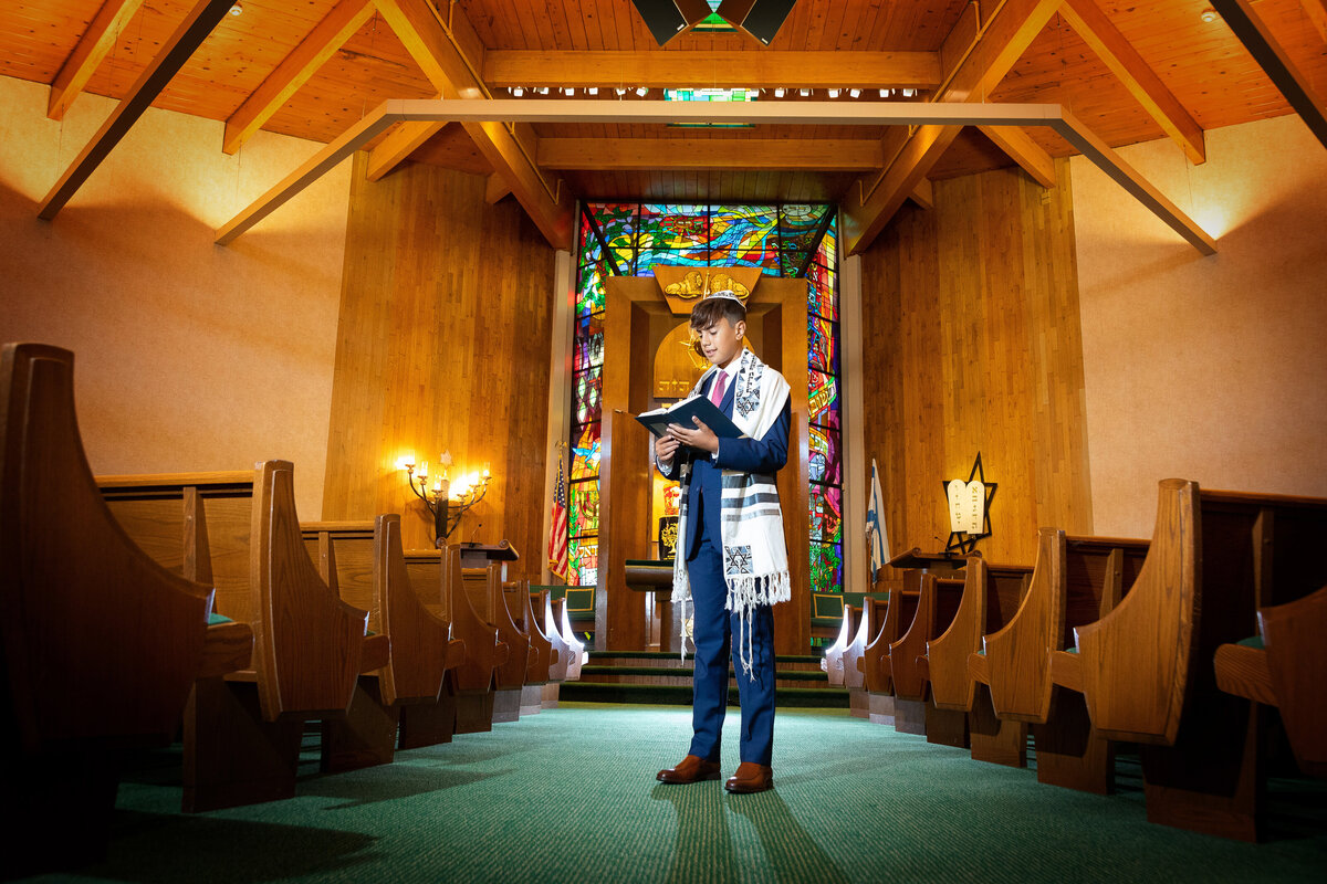 bar-mitzvah-boy-reading-siddur-prayer-book-nj