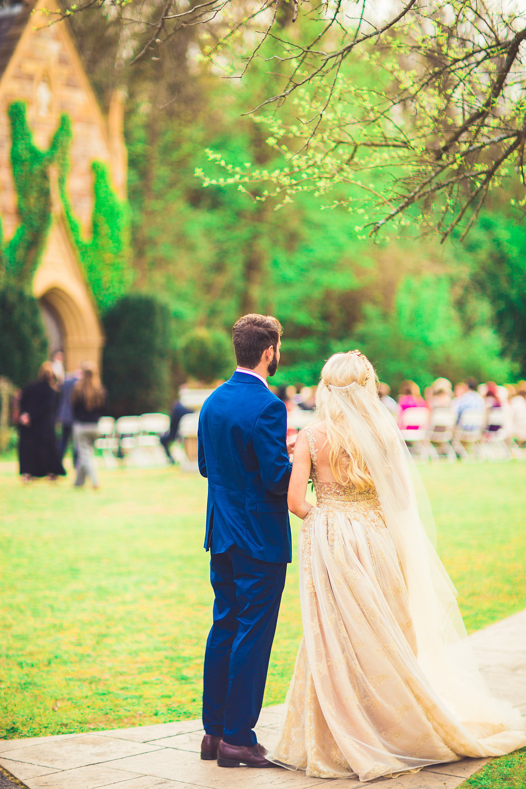 Wedding Photograph Of Bride in Her Wedding Dress and Groom in Blue Suit Standing Los Angeles
